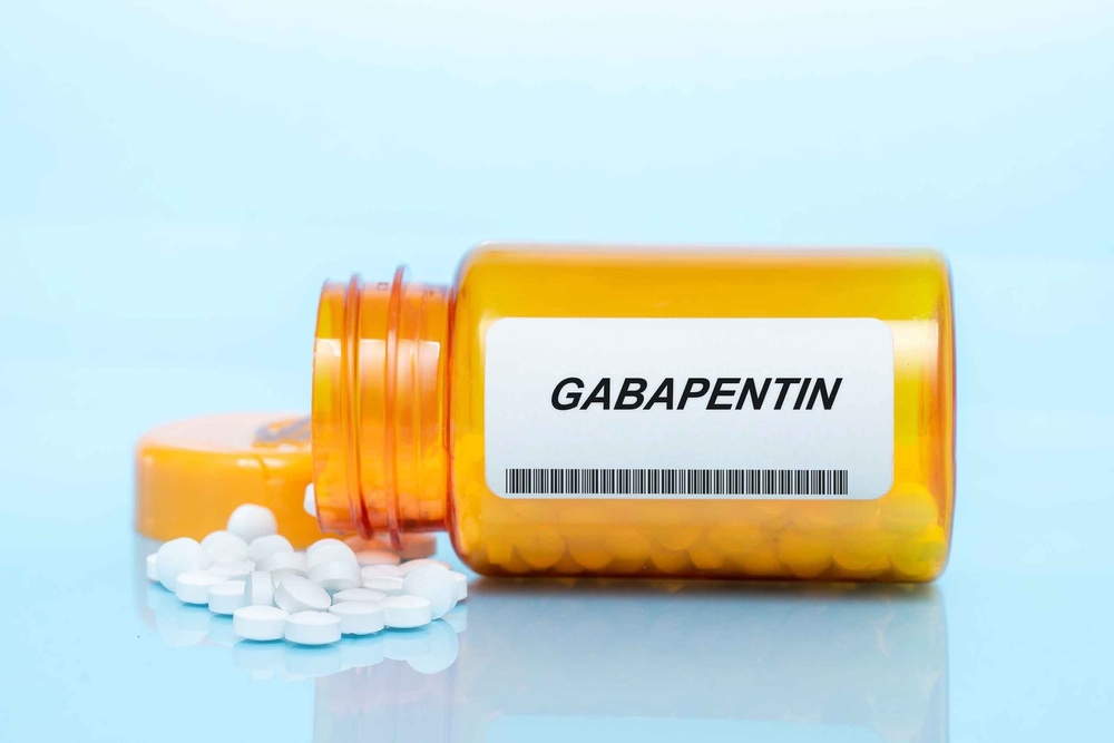Bottle of gabapentin pills on a table surface