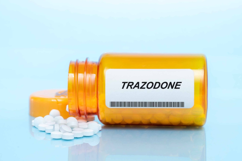 Bottle of trazodone pills on the surface of a table 