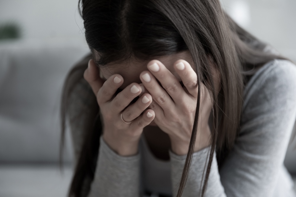 Woman in alcohol detox struggling with pain 