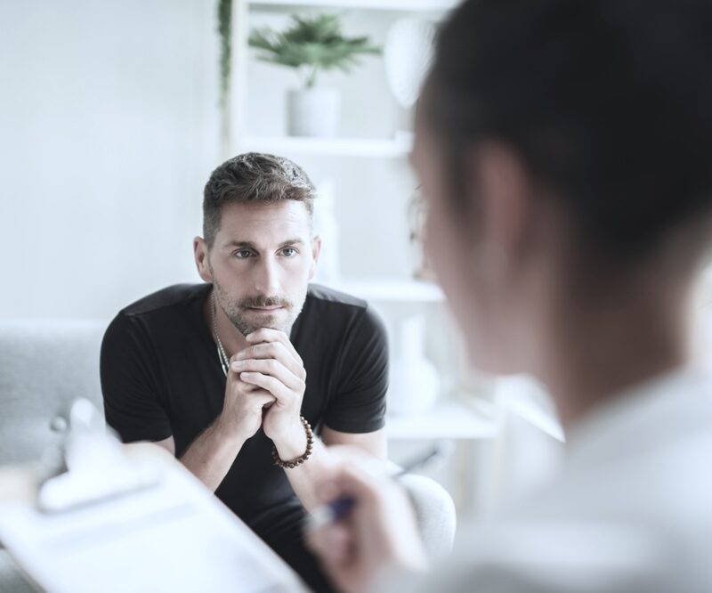 Man in therapy in rehab after detox treatment