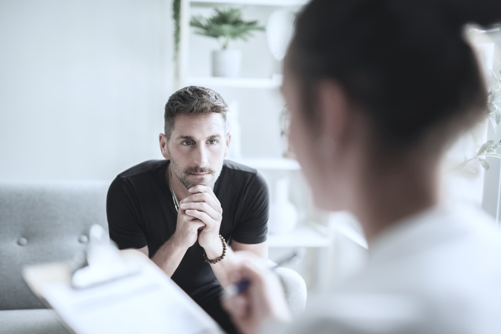 Man in therapy in rehab after detox treatment
